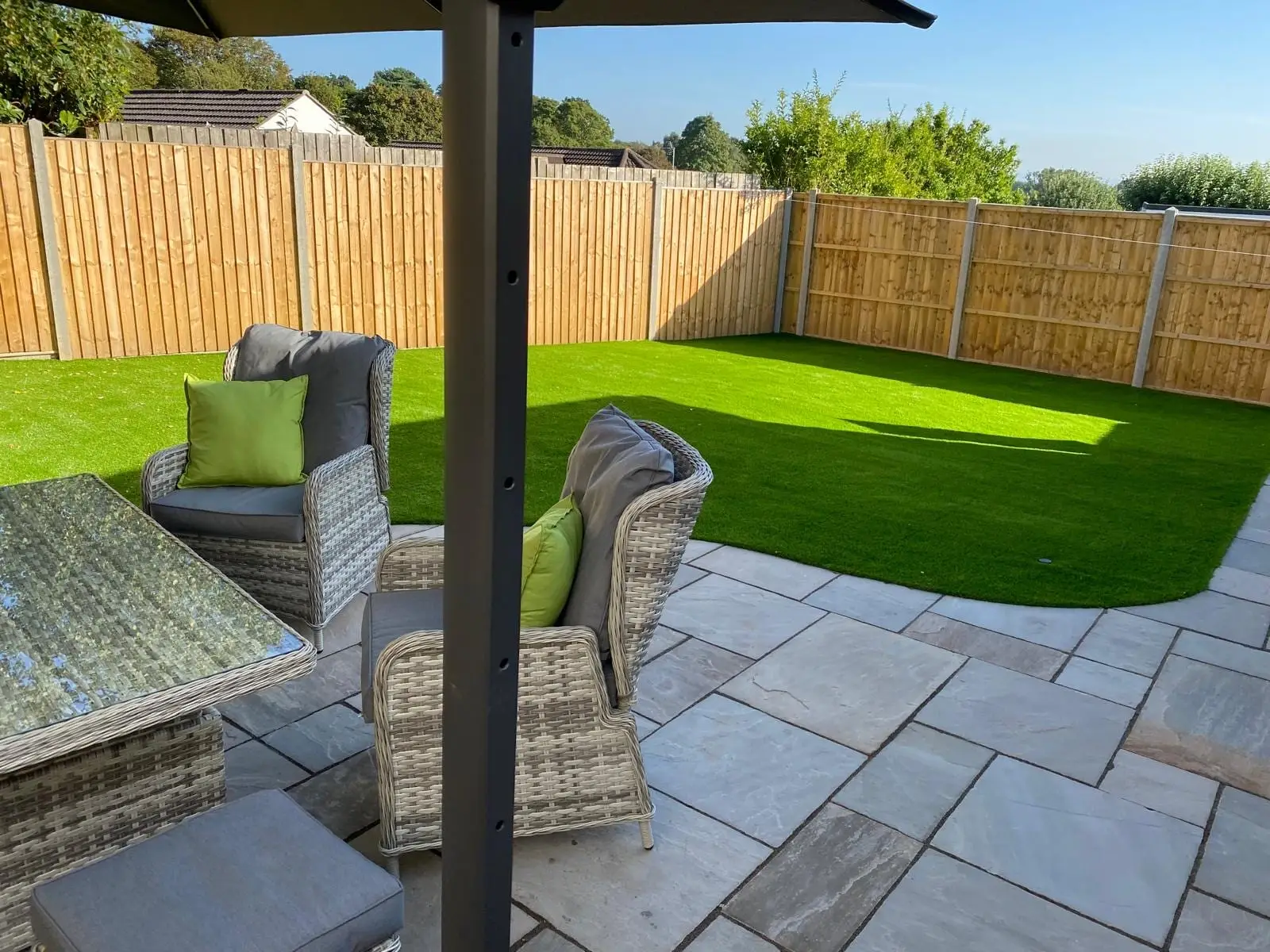 The finished garden: sandstone patio, lawn and new close-board fencing