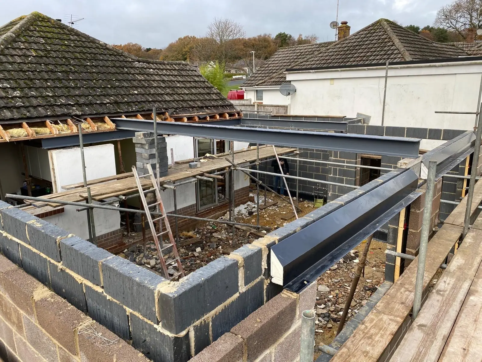 Steels landed on the new blockwork with the roof stripped back behind them