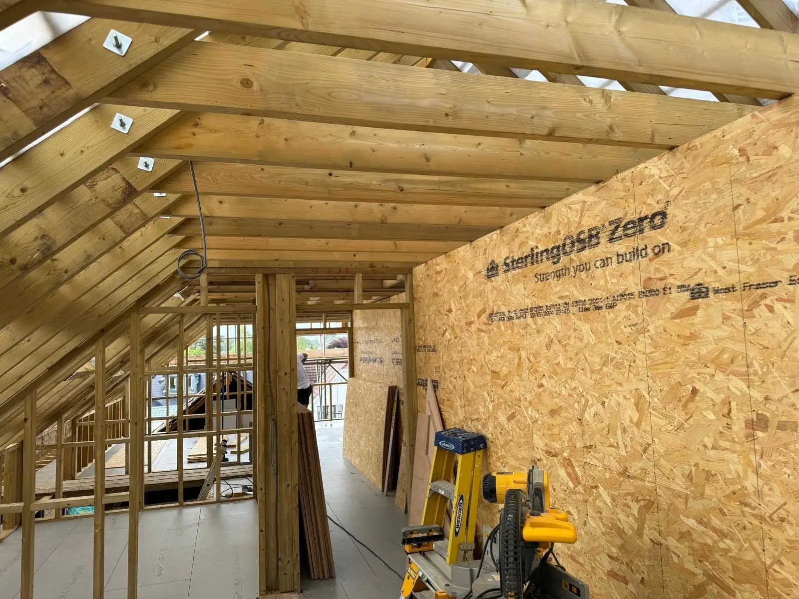 The new first floor framed and sheathed in OSB, with stud partitions set out