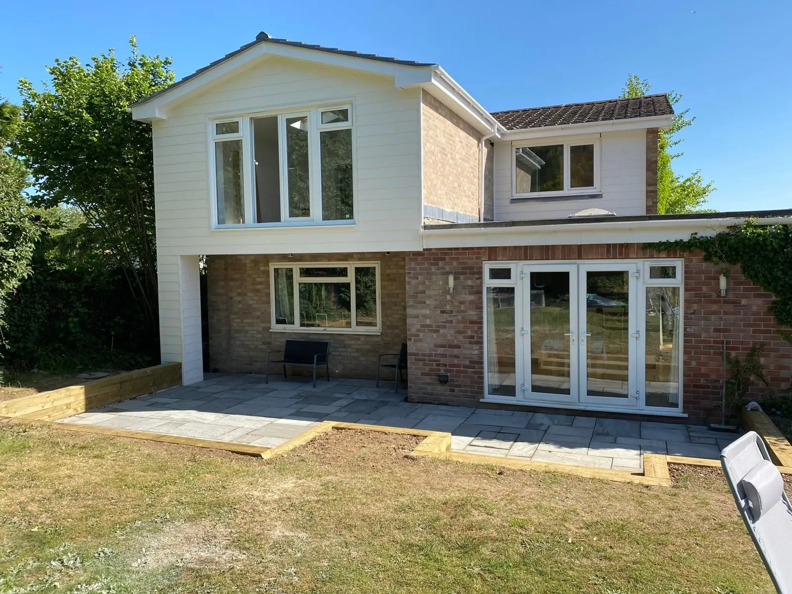 The finished house from the bottom of the garden, showing the extension against the original brickwork