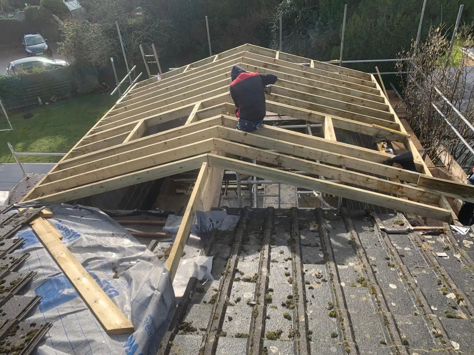 New rafters being cut and fixed over the stripped roof